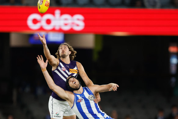 Tristan Xerri of the Kangaroos and Luke Jackson of the Dockers.