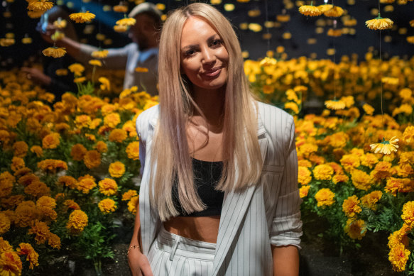 Samantha Jade poses inside the flower room at the Happy Place exhibition at Broadway in Sydney.