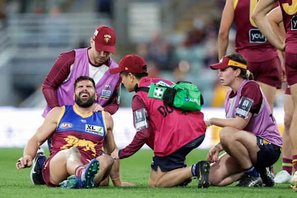 Marcus Adams pictured being assisted by trainers during round 21 last season.