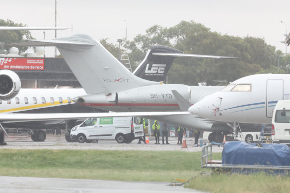 Taylor Swift’s plane (grey with red stripe) at the hangar of the executive jet section of Sydney airport on Monday afternoon.
