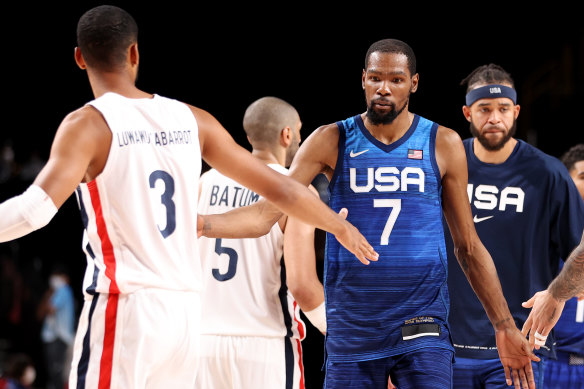 Team USA’s Kevin Durant shakes hands with French opponents.