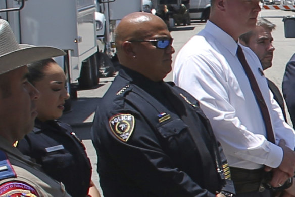 Uvalde School Police Chief Pete Arredondo, third from left, stands during a news conference outside of the Robb Elementary school in Uvalde, Texas on May 26.