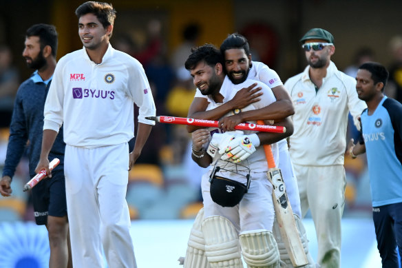 Rishabh Pant celebrates victory with his teammates.