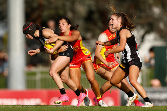 Brit Bonnici (left) was in the thick of the action all day for Collingwood against the Suns.