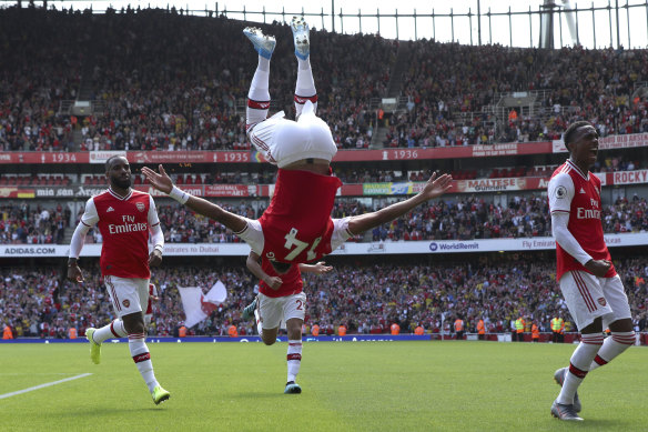 Arsenal's Pierre-Emerick Aubameyang, centre, celebrates a goal.