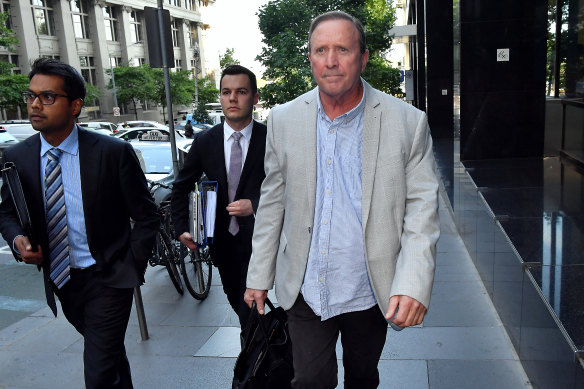 Casey councillor and former Liberal Party state candidate Geoff Ablett leaves after giving evidence at the anti-corruption commission.