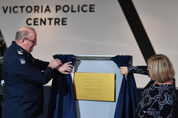 Victoria Police's outgoing Chief Commissioner Graham Ashton and Police Minister Lisa Neville at the official opening of the new police HQ in Spencer Street.