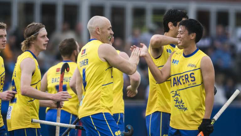 Glenn Turner celebrates with his team after scoring the first goal.