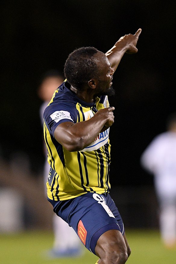 Trademark celebration: Usain Bolt enjoys his first strike.