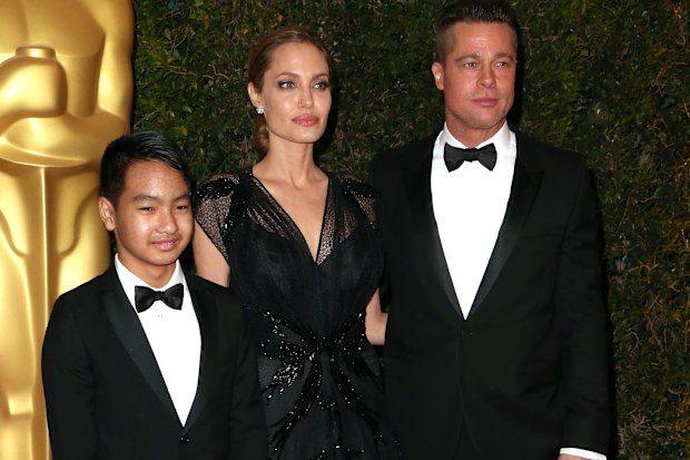 Maddox Jolie-Pitt with parents Angelina Jolie and Brad PItt at the Academy of Motion Picture Arts and Sciences' Governors Awards in November 2013.
