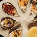 Hot oysters are available in kilpatrick, mornay, baked miso, rockefeller, garlic butter crumb.