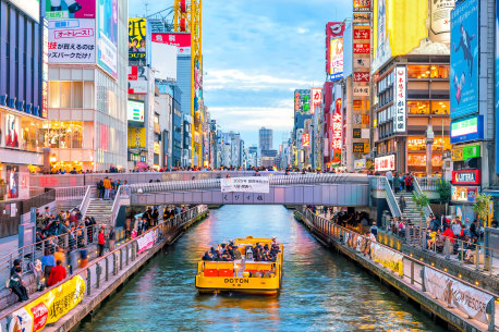 Tourists flock to Osaka’s Dotonburi to have a Japanese shopping experience.