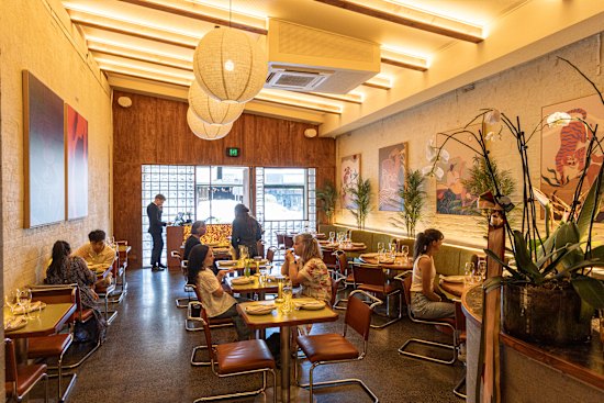 Tyga’s long room spills from a bar zone with DJ decks to a charcoal-fired open kitchen.
