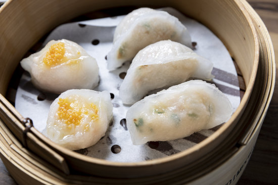 Prawn and chive dumplings (right) and scallop and prawn dumplings.