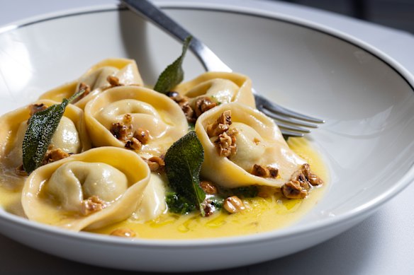 Cappelletti stuffed with four cheeses on top of cavolo nero purée with a parmigiano fondue, burnt-butter sage and hazelnuts.