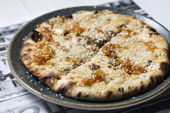 Keema naan stuffed with minced lamb and topped with mango chutney.