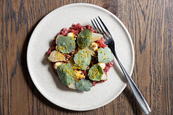 Beef tartare with green strawberries. 