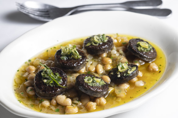 Black sausage with braised white beans and chickpeas.