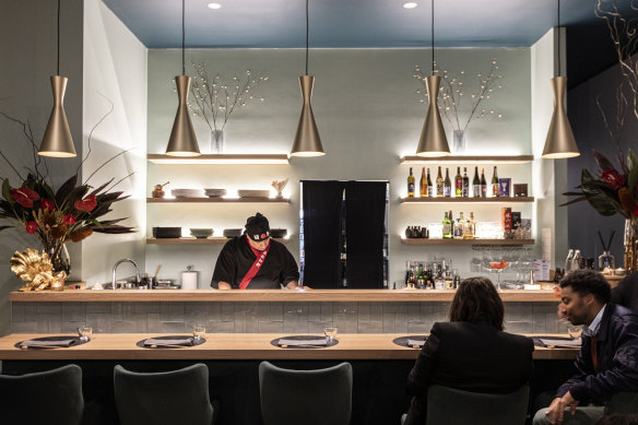 Chef Peterson Maia Machado Correia behind the counter at Oshan.