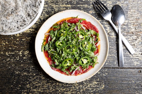 Vietnamese beef carpaccio with rice crackers.
