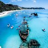 Tangalooma Beach, on Moreton Island, is slated for shark surveillance drones alongside about a dozen popular beaches earmarked by the Queensland government for drones, nets, and drumlines.