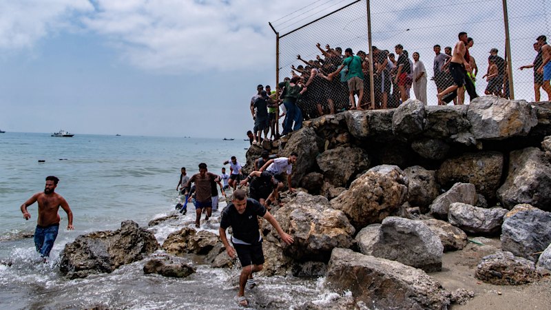 ‘Absolute chaos’ as thousands of people breach Morocco’s border with Spain’s Ceuta