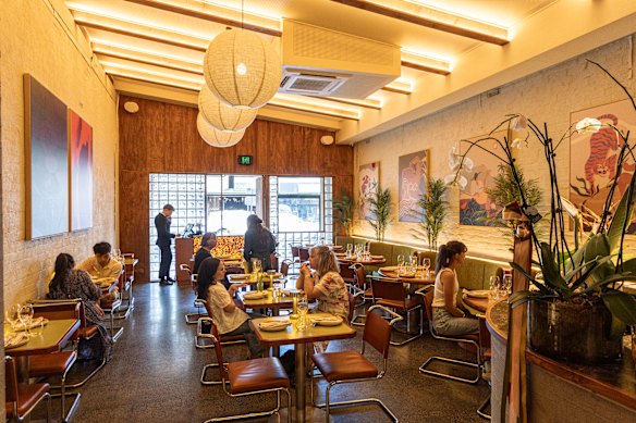 Tyga’s long room spills from a bar zone with DJ decks to a charcoal-fired open kitchen.