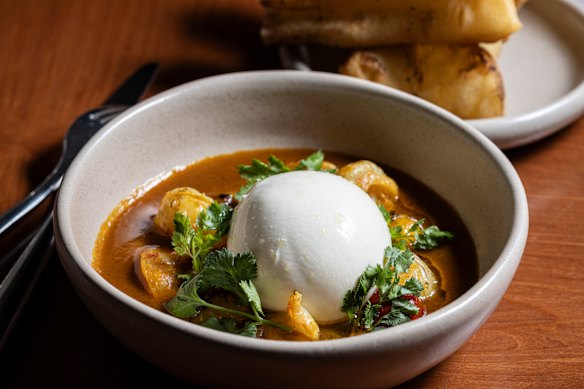 Tom yum burrata served with yaowarat doughnuts for dipping into the hot-and-sour prawn broth.