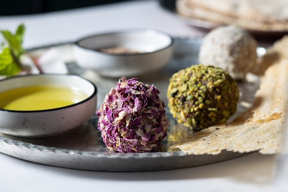 Lamb naye balls coated with sesame seeds, crushed pistachio and dried rose petals.