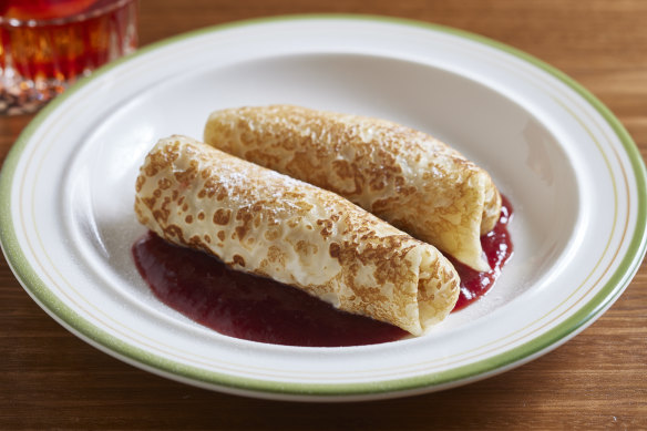 Blintz with cheesecake filling and plum sauce.