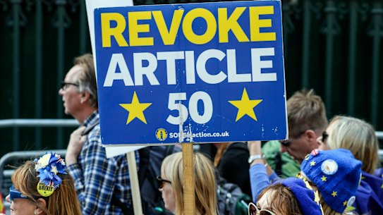 Anti-Brexit demonstrators attend a protest at Parliament Square in London on Tuesday.