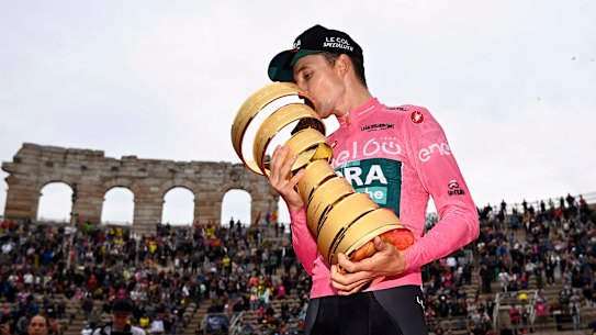 ustralia’s Jai Hindley kisses the trophy at the end of the 21st stage against the clock race of the Giro D’Italia, in Verona, Italy, Sunday, May 29, 2022. (Fabio Ferrari/LaPresse via AP)