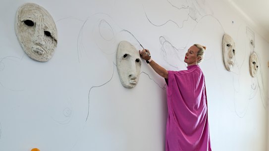 Sanné Mestrom and son Danté drawing in the wide entry hall. “I use every part of my home, inside and out, to make or display art,” Mestrom says.