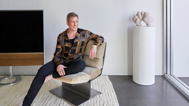 David Hicks seated on a 1970s Uginox lounge chair. The sculpture is by Narelle White and the copper glass disc is from eModerno.