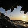 Ice melts on tundra and thawing permafrost in Newtok, Alaska, this fall