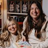 Larissa Chadwick, left, who runs a monthly book club dedicated to romance fiction, with best friend and fellow club member Reagen McKean.