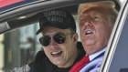 Donald Trump and Elon Musk speak to reporters as they sit in the Tesla Model S.