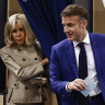 French President Emmanuel Macron and his wife Brigitte Macron leave the voting booth before voting in Le Touquet-Paris-Plage, northern France.