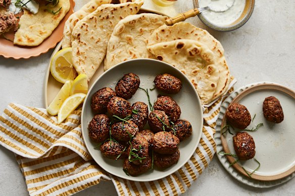 Beef koftas with pita bread and minted yoghurt.