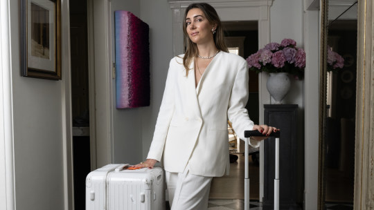 Olivia Bond at home with her Rimowa luggage.