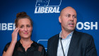 Josh Frydenberg addresses Liberal supporters on Saturday night alongside his wife Amie.