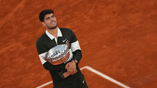 Carlos Alcaraz with the French Open trophy.