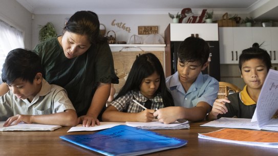 Jolina Crescini with her children Roman Crescin,7, Emerald,9, Dean Crescin,11, and Myles Crescin,13. For a story about about how much it costs to educate a child for 13 years of schooling. January 24, 2023. Photo: Rhett Wyman / SMH