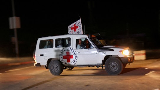 A Red Cross vehicle, part of a convoy carrying hostages, leaves Gaza through the Egypt Rafah crossing.