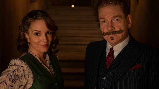 Tina Fey as Ariadne Oliver and Kenneth Branagh as Hercule Poirot in A Haunting in Venice.