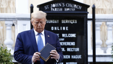 US President Donald Trump holds a Bible as he visits St John's Church, across Lafayette Park from the White House, on Monday.