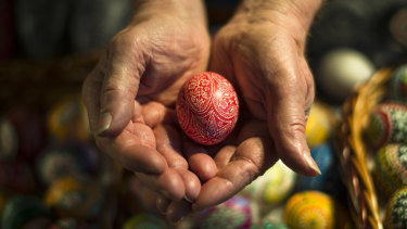 Werner Zaroba with a hand-decorated Easter egg at a traditional market held by Germany's Sorb minority in the village Neuwiese, near Hoyerswerda.