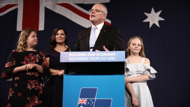 Flanked by his wife and daughters, Scott Morrison declares victory in front of the party faithful on May 18, 2019.