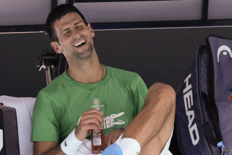Novak Djokovic shares a laugh during a break on the Rod Laver Arena on Thursday. 