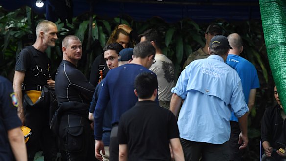 Australian doctor Richard Harris (in light blue shirt) at the base camp where the rescue operations are now under way.